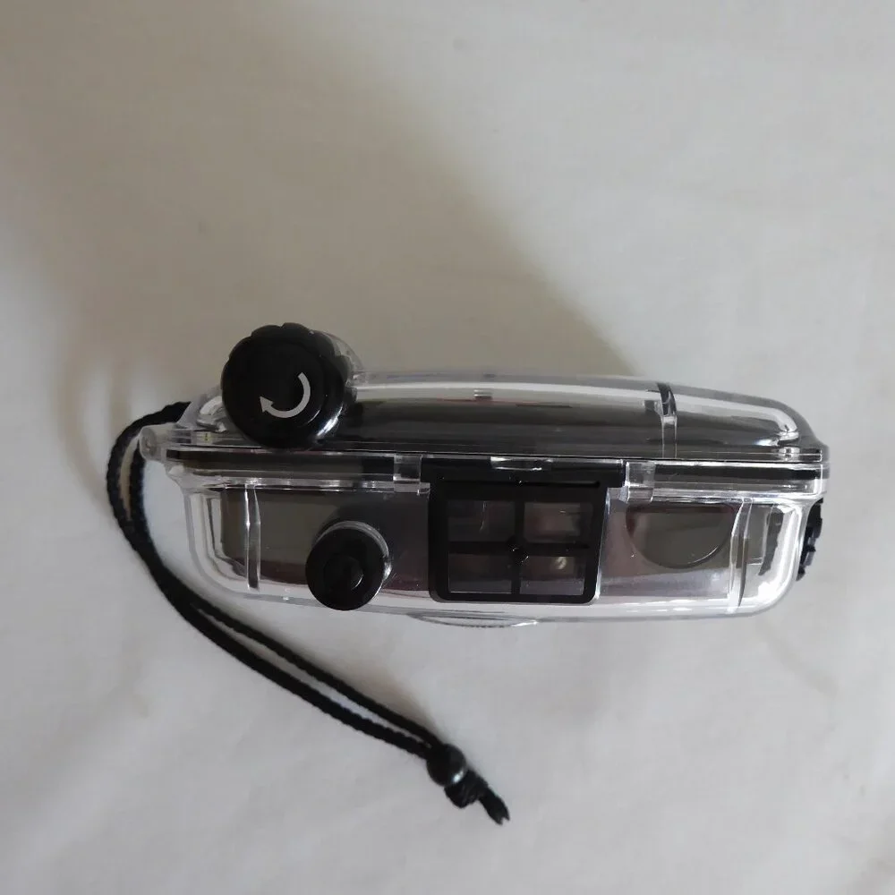 USED ONCE WATERPROOF SPORT UTILITY COMPACT 35mm CAMERA IN CASING